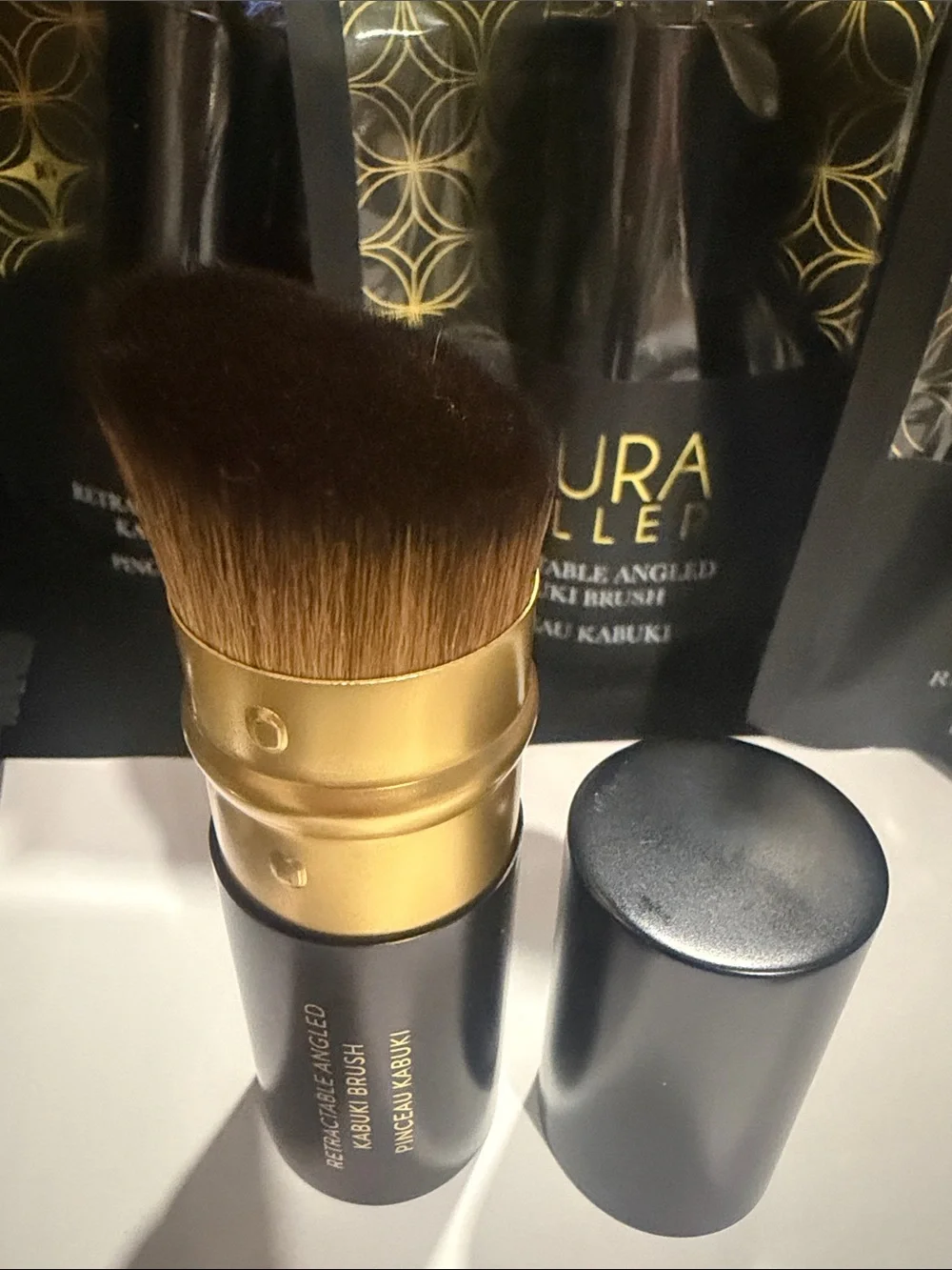 Laura Geller Black and Gold Retractable Angled Kabuki Brush brand new